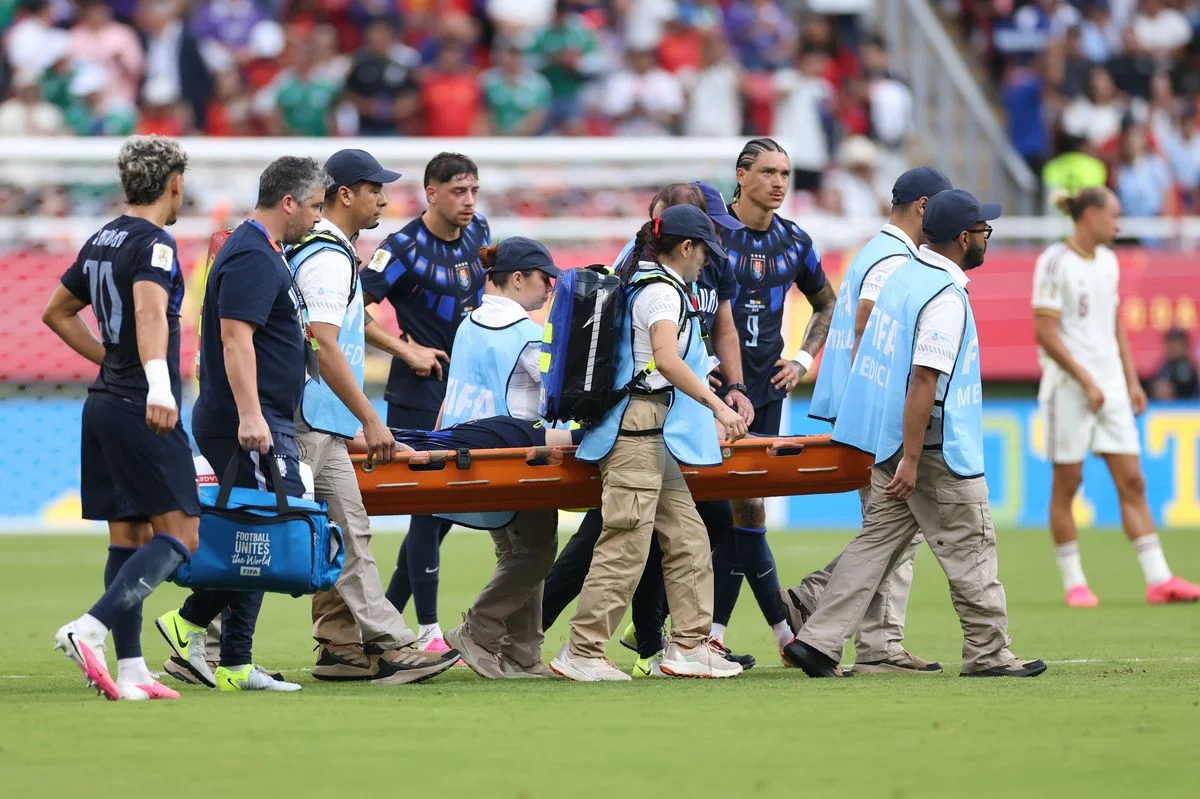 Manuel Ugarte was stretchered off with a suspected knee injury