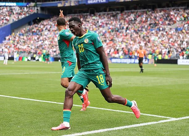 Ismaila Sarr celebrates after scoring vs Belgium