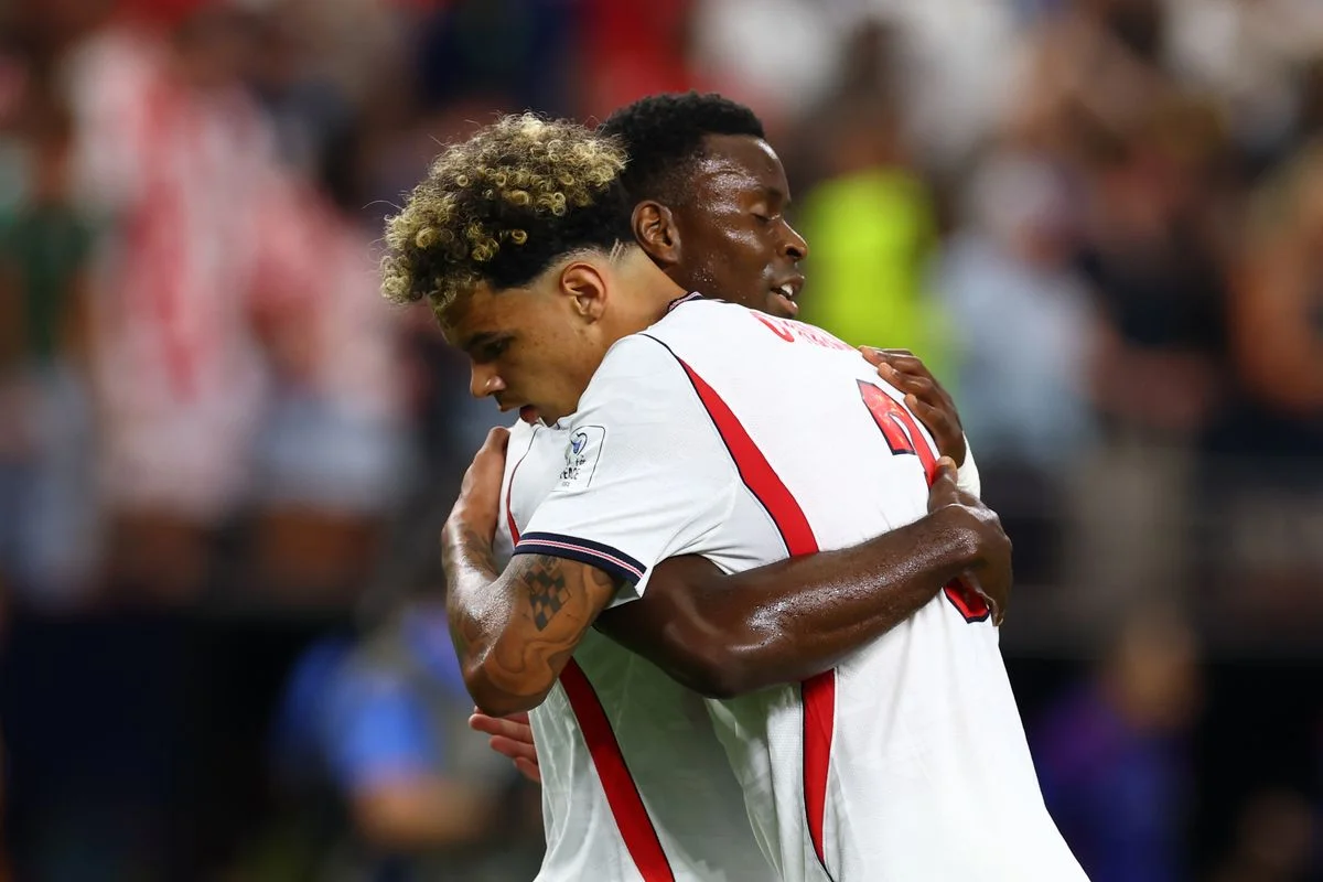 Marc Guehi of England reacts with Nico O'Reilly at the end of the FIFA World Cup 2026 Group L match between England and Croatia at Dallas Stadium on June 17, 2026 in Dallas, United States. 